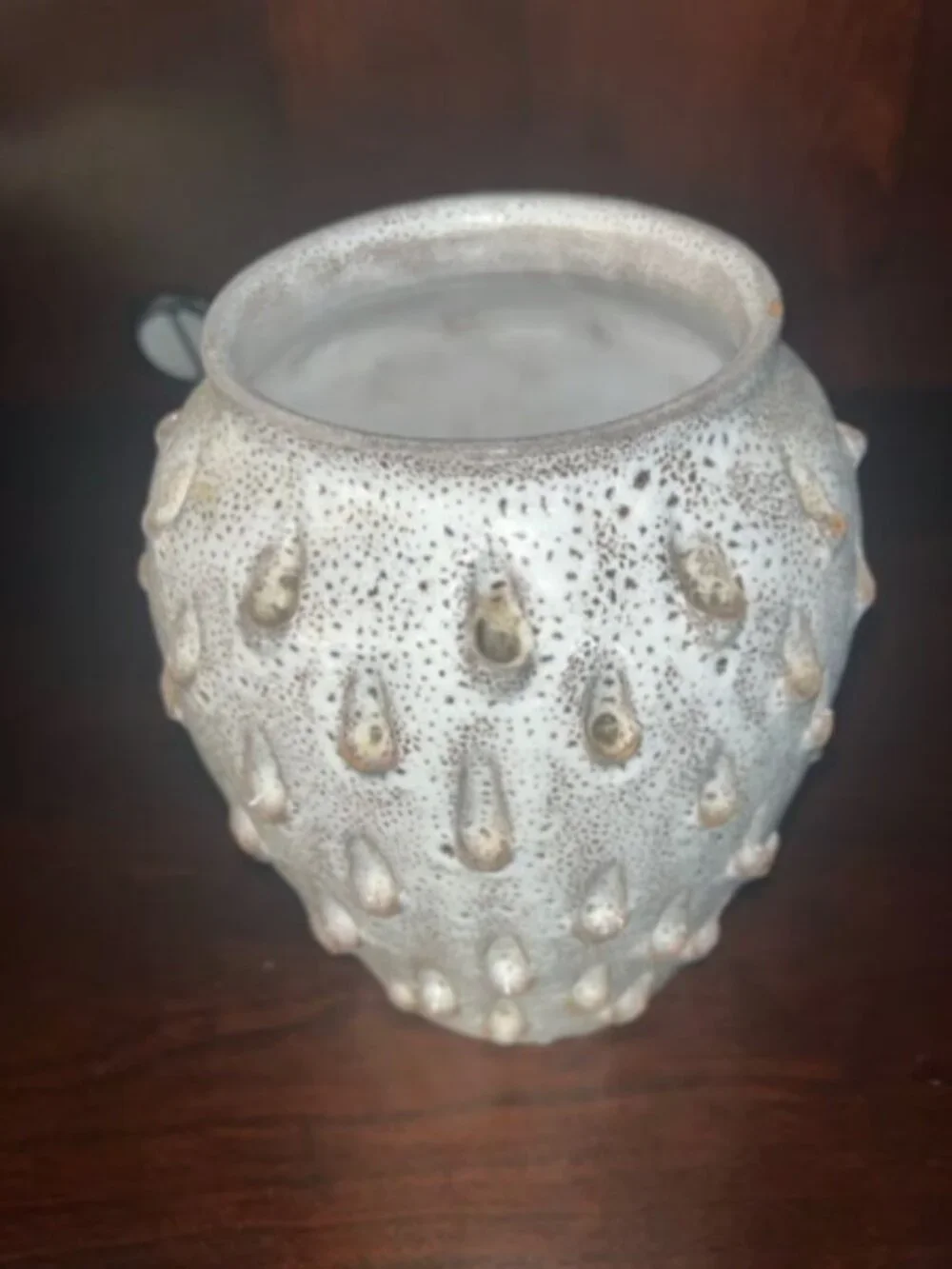 Ceramic vase with white speckled teardrop-shaped patterns